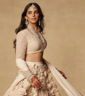 Radhika Merchant wearing Isha Ambani's 2018 wedding lehenga at a recent wedding